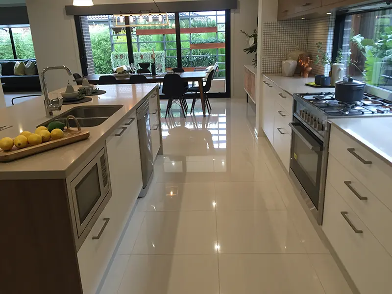 White porcelain floor tiles in kitchen area