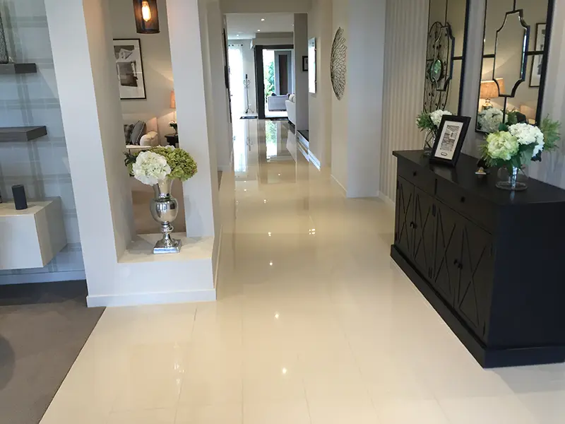 White porcelain floor tiles in hallway