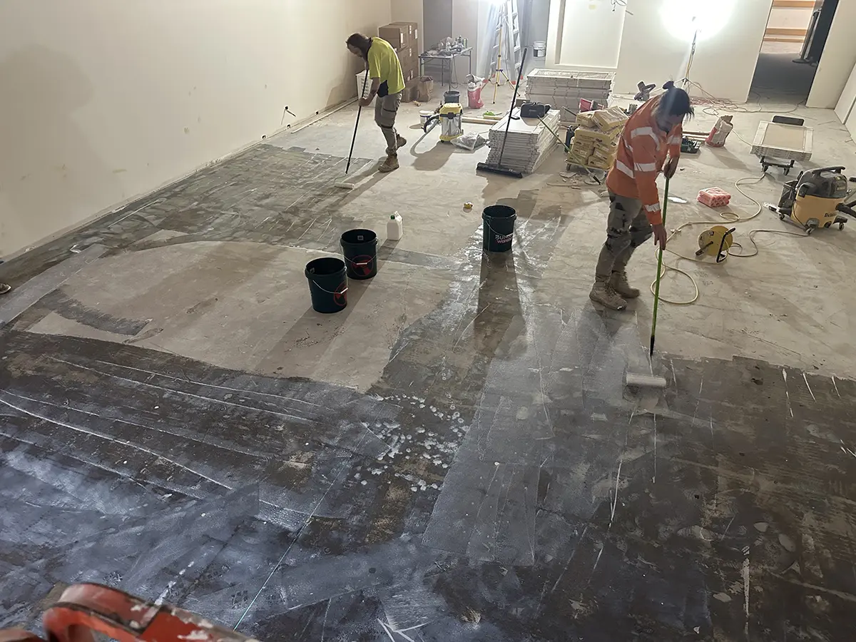 Priming the concrete for tiling