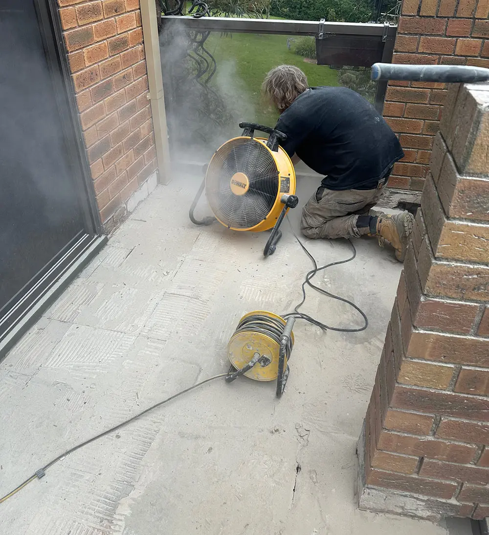 Removing old tiles from balcony