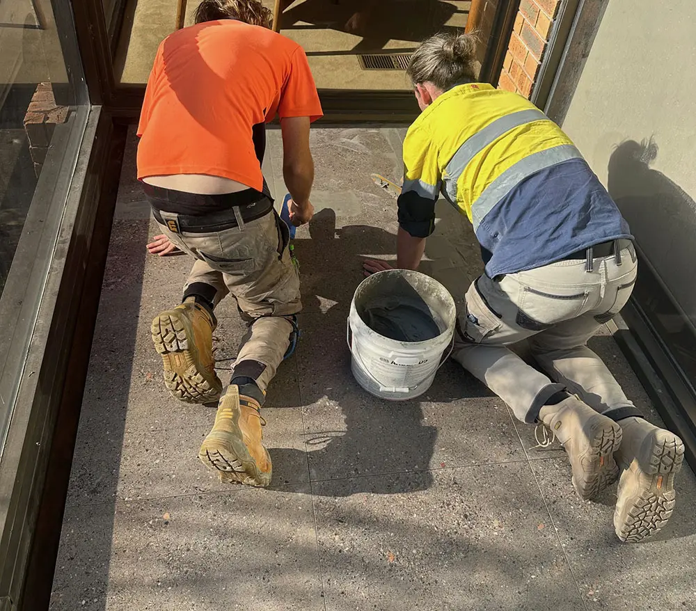 Grouting tiles on a balcony