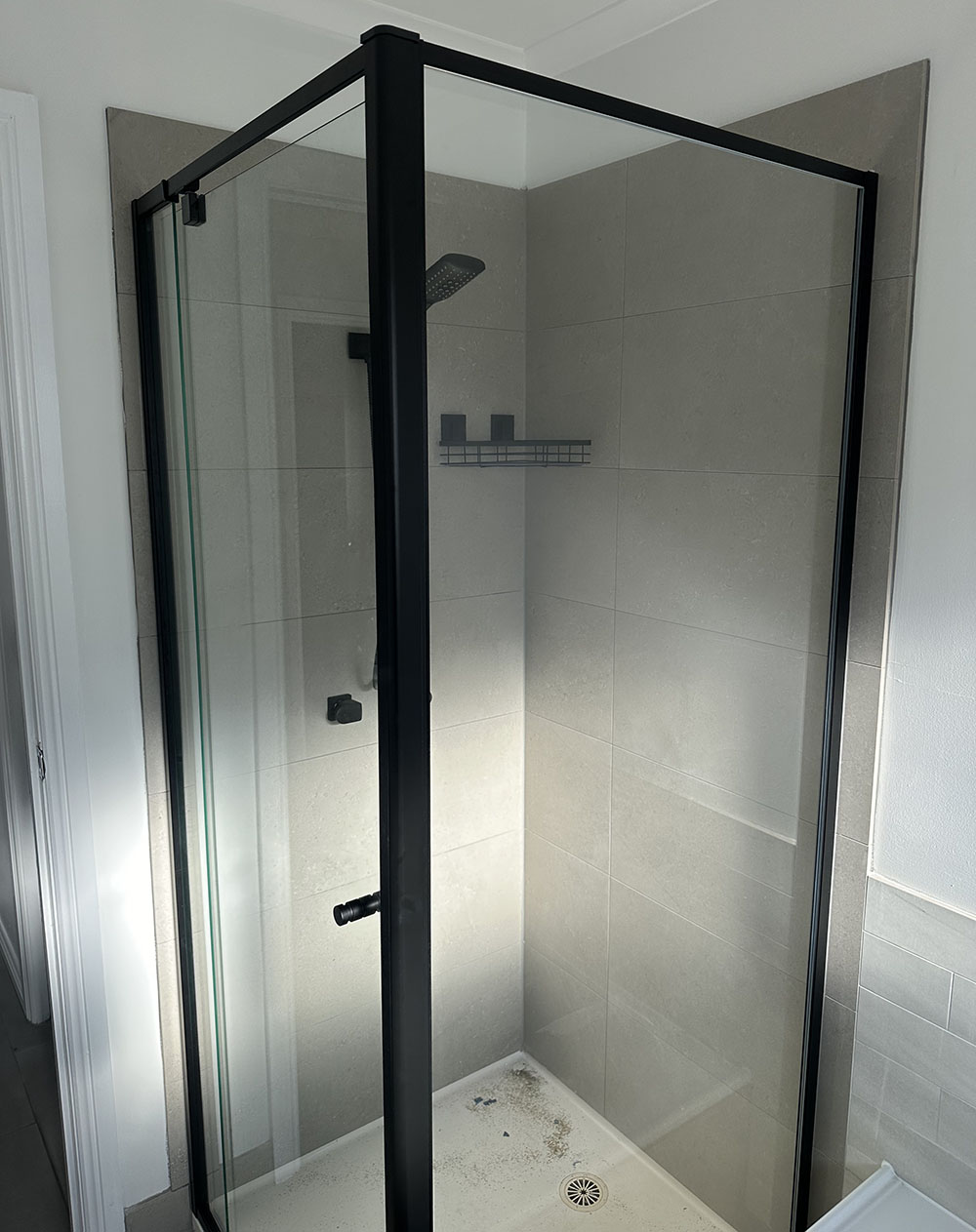 New black semi-frameless shower screen