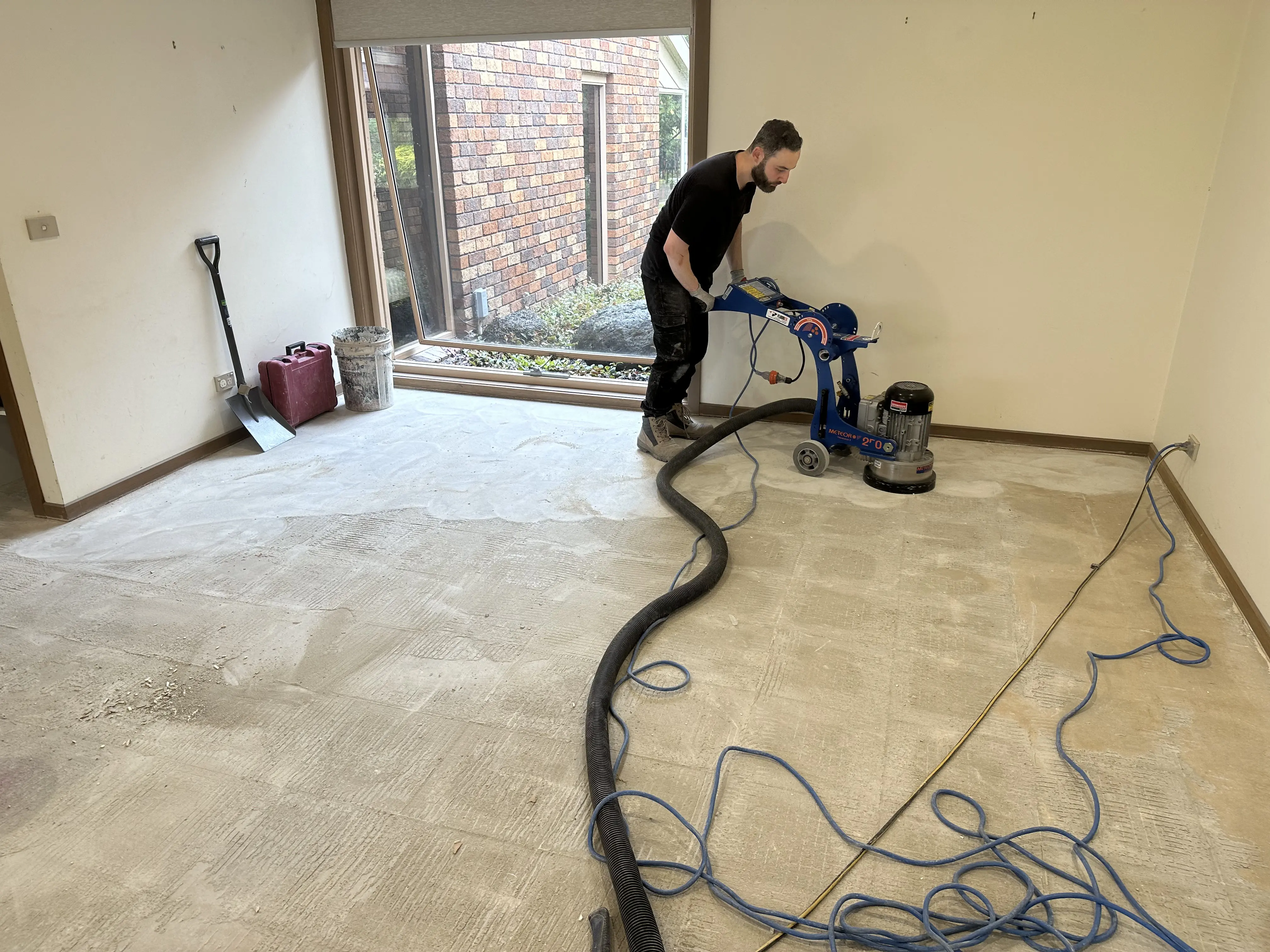 Sanding concrete for tiling